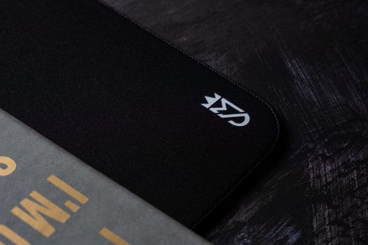 black mousepads on a gray surface